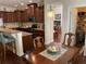 Inviting dining area adjacent to the kitchen, featuring hardwood floors and a stylish pendant light at 505 Heartland Ct., Murrells Inlet, SC 29576