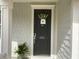 Welcoming front door with decorative wreath, house number 505, and a potted fern at 505 Heartland Ct., Murrells Inlet, SC 29576