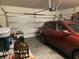 Spacious garage interior with modern door, storage shelves, and a parked red vehicle at 505 Heartland Ct., Murrells Inlet, SC 29576