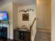 Inviting living room with stairs to second story and a fireplace, with TV and decor on display at 505 Heartland Ct., Murrells Inlet, SC 29576