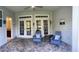 Spacious backyard patio featuring comfortable seating and access to an adjacent bathroom at 505 Heartland Ct., Murrells Inlet, SC 29576