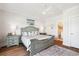 Comfortable bedroom featuring a queen-sized bed, soft colors, and wood flooring at 5203 N Ocean Blvd. N, North Myrtle Beach, SC 29582