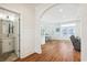 Bright hallway with hardwood floors, an archway leading to the main living space, and a half bath on the left at 5203 N Ocean Blvd. N, North Myrtle Beach, SC 29582