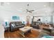 Open-concept living space showing the living room, kitchen, and dining area with hardwood floors and modern furnishings at 5203 N Ocean Blvd. N, North Myrtle Beach, SC 29582