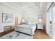 Serene bedroom featuring hardwood floors, a king bed, light blue and white décor, and access to a private balcony at 5203 N Ocean Blvd. N, North Myrtle Beach, SC 29582