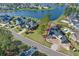 Aerial view of the vacant lot in red with existing homes being built near a community lake at 573 Starlit Way, Myrtle Beach, SC 29579