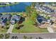 An aerial view of a spacious vacant lot in a waterfront community, outlined in red, awaiting construction at 573 Starlit Way, Myrtle Beach, SC 29579