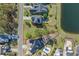 Aerial view of a vacant lot for sale near a lake with established homes and lush landscaping at 573 Starlit Way, Myrtle Beach, SC 29579