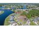 An aerial view of a lakefront home shows mature landscaping and beautiful views at 573 Starlit Way, Myrtle Beach, SC 29579