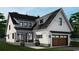 New construction home featuring a stylish exterior with a two-car garage and covered front porch at 573 Starlit Way, Myrtle Beach, SC 29579