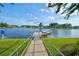 Enjoy a serene view from the boat dock to the beautiful lake, showcasing the community's peaceful setting at 573 Starlit Way, Myrtle Beach, SC 29579