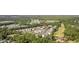 Beautiful aerial view of golf course community featuring lush greenery and well-maintained condominium buildings at 5882 Longwood Dr. # 201, Murrells Inlet, SC 29576