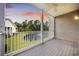 Outdoor balcony with a ceiling fan and views of the pond at 5882 Longwood Dr. # 201, Murrells Inlet, SC 29576