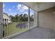 Outdoor balcony with a ceiling fan and pond views at 5882 Longwood Dr. # 201, Murrells Inlet, SC 29576