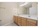 Bright bathroom featuring a double sink vanity, large mirror and shower with tub at 5882 Longwood Dr. # 201, Murrells Inlet, SC 29576