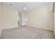 Spacious carpeted bedroom with ceiling fan and light yellow painted walls at 5882 Longwood Dr. # 201, Murrells Inlet, SC 29576