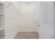 Walk-in closet with carpet and metal shelving for optimal storage at 5882 Longwood Dr. # 201, Murrells Inlet, SC 29576