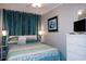 Bedroom featuring a large bed, coastal decor, and ample storage at 5905 S Kings Hwy. # 404 A, Myrtle Beach, SC 29575