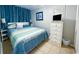 Bedroom featuring a large bed, coastal decor, and ample storage at 5905 S Kings Hwy. # 404 A, Myrtle Beach, SC 29575