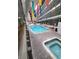 Bright indoor pool area featuring a jacuzzi and colorful hanging decorations at 5905 S Kings Hwy. # 404 A, Myrtle Beach, SC 29575