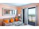 Comfortable living room area with ocean view balcony access and cozy seating at 5905 S Kings Hwy. # 404 A, Myrtle Beach, SC 29575