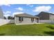 Backyard featuring a well-maintained lawn, privacy fence and view of the home's covered patio at 591 Meadowgrass Ct., Myrtle Beach, SC 29588