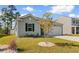 Quaint home with a well-manicured lawn, accented by a decorative tree at 591 Meadowgrass Ct., Myrtle Beach, SC 29588