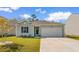 Charming single-story home with a one-car garage and well-maintained front lawn at 591 Meadowgrass Ct., Myrtle Beach, SC 29588