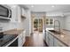 Bright kitchen featuring granite countertops, subway tile backsplash, and stainless steel appliances at 591 Meadowgrass Ct., Myrtle Beach, SC 29588