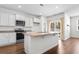 Spacious kitchen island complemented by white cabinetry and a stylish faucet at 591 Meadowgrass Ct., Myrtle Beach, SC 29588