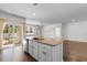 Open concept kitchen features an island, granite countertops, and stainless steel appliances at 591 Meadowgrass Ct., Myrtle Beach, SC 29588