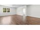 Bright living room boasts hardwood floors and a large window for natural light at 591 Meadowgrass Ct., Myrtle Beach, SC 29588