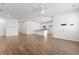 Open concept living room boasts hardwood floors and stainless appliances in the kitchen at 591 Meadowgrass Ct., Myrtle Beach, SC 29588