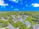 An aerial view of the neighborhood with lush greenery, a pond, and manicured lawns at 6000 Isabel Ct., Myrtle Beach, SC 29579