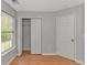 Bedroom featuring natural light, hardwood floors, closet and door at 6000 Isabel Ct., Myrtle Beach, SC 29579