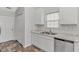 Functional kitchen featuring granite countertops, white cabinets, and stainless steel dishwasher at 6000 Isabel Ct., Myrtle Beach, SC 29579