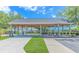 Community pavilion featuring covered picnic tables, painted support posts, and an accessible entrance at 6000 Isabel Ct., Myrtle Beach, SC 29579