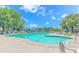 Community pool featuring crystal-clear water, lounge chairs, and umbrellas for a relaxing and enjoyable experience at 6000 Isabel Ct., Myrtle Beach, SC 29579