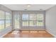 Bright sunroom with large windows offering plenty of natural light and views of the backyard at 6000 Isabel Ct., Myrtle Beach, SC 29579