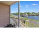 A view from the balcony shows a waterfront community, tranquil waters, and a blue sky backdrop at 608 Waterway Village Blvd. # 27-F, Myrtle Beach, SC 29579