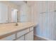 Bright bathroom area showing light-colored, vertically striped wallpaper and large vanity at 608 Waterway Village Blvd. # 27-F, Myrtle Beach, SC 29579