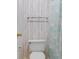 Clean, standard toilet area accented with colorful striped wallpaper and accents at 608 Waterway Village Blvd. # 27-F, Myrtle Beach, SC 29579