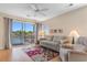 Cozy living room with a ceiling fan, plush seating, and a sliding glass door to a water view balcony at 608 Waterway Village Blvd. # 27-F, Myrtle Beach, SC 29579