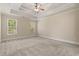 Bright bedroom with a trey ceiling, ceiling fan, and two large windows at 610 Cocas Dr., Myrtle Beach, SC 29579