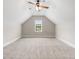 Spacious bedroom features a vaulted ceiling, plush carpet, and a bright window at 610 Cocas Dr., Myrtle Beach, SC 29579