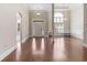Elegant foyer with hardwood flooring, large windows, and a decorative column at 610 Cocas Dr., Myrtle Beach, SC 29579