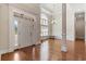 Bright foyer with hardwood floors, a large window, and an elegant chandelier at 610 Cocas Dr., Myrtle Beach, SC 29579