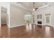A living room featuring hardwood floors, a fireplace, and tray ceilings at 610 Cocas Dr., Myrtle Beach, SC 29579