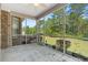 Relaxing screened porch with brick accents and a view of the landscaped backyard at 610 Cocas Dr., Myrtle Beach, SC 29579