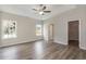 Spacious bedroom featuring a ceiling fan, two bright windows, and a walk-in closet at 625 Woodside Dr., Conway, SC 29526